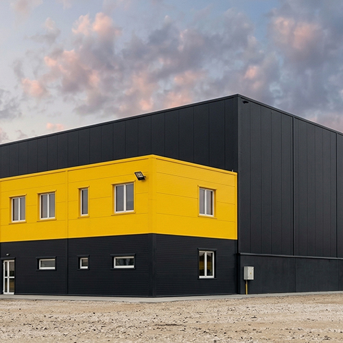 Modern industrial plant facade project - Showcasing prefabricated building utilizing RS custom yellow and dark grey color steel integrated panels