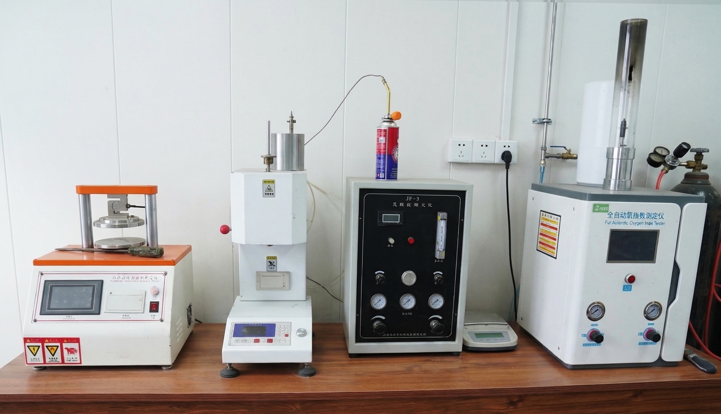 Professional laboratory testing equipment for EPS insulation quality control including oxygen index and compressive strength testers