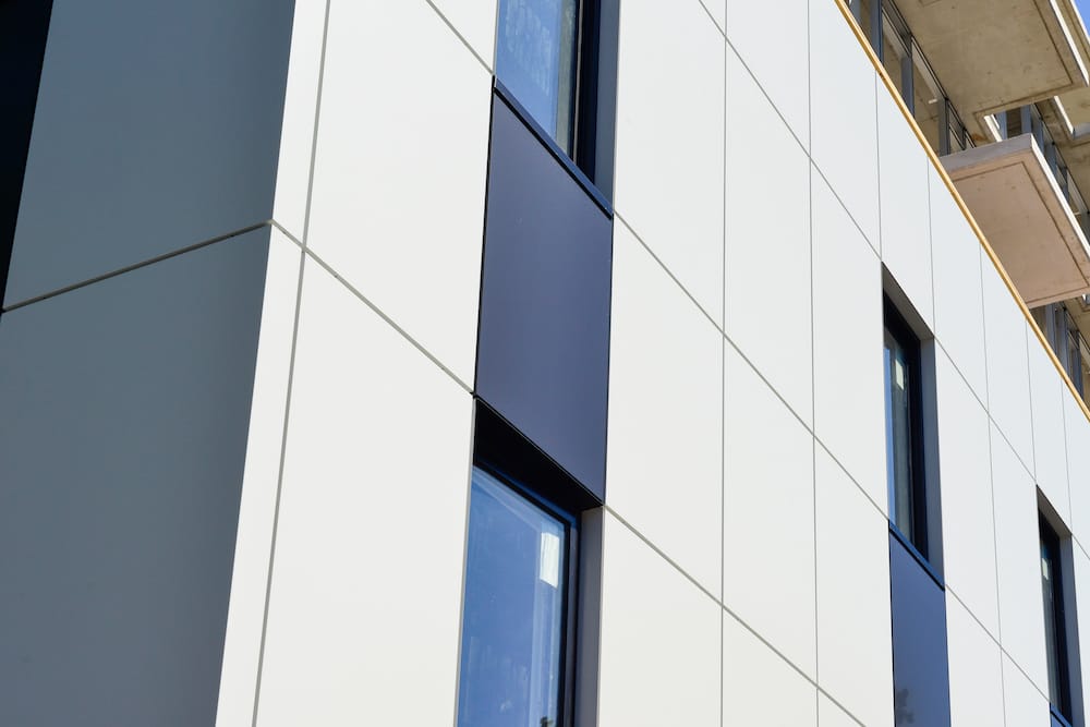 Modern building facade featuring white integrated insulation and decoration panels for premium curtain walling systems